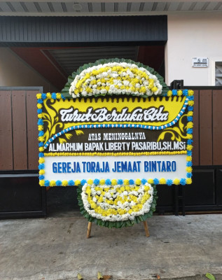 Papan Bunga Duka di Batu Kota